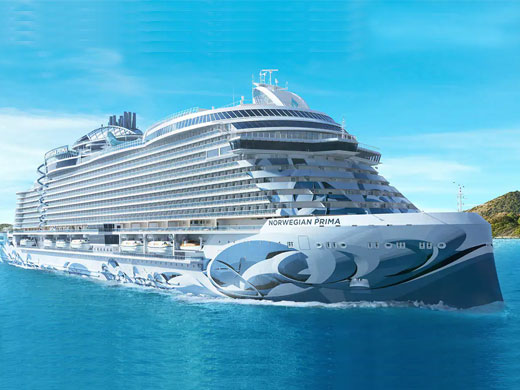 Norwegian Prima cruise ship in turquoise waters under blue sky