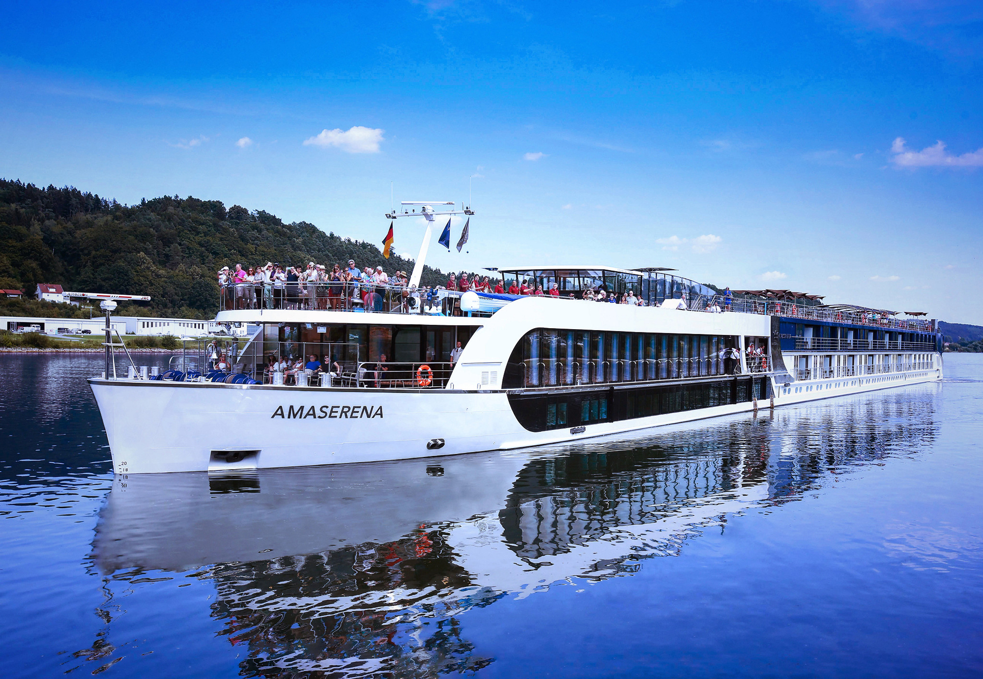 AmaSerena River Cruise Vessel on Calm Waters AmaSerena river cruise ship sailing on a scenic European waterway
