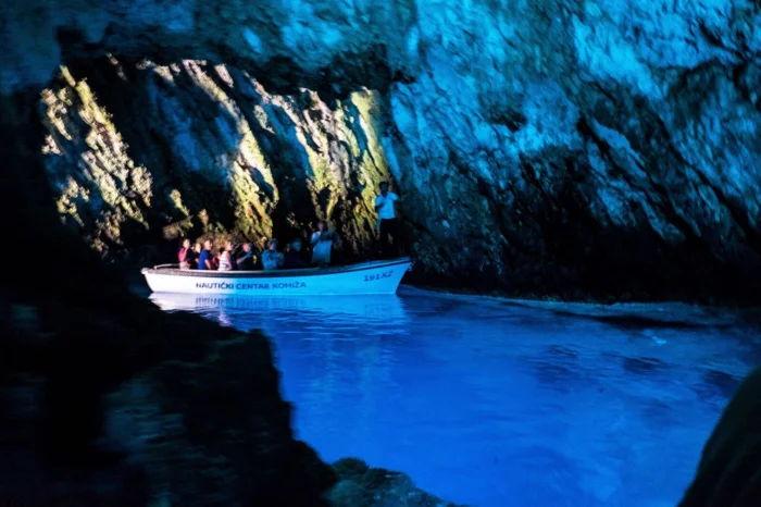 Blue Grotto cave boat tour with stunning blue water and limestone formations