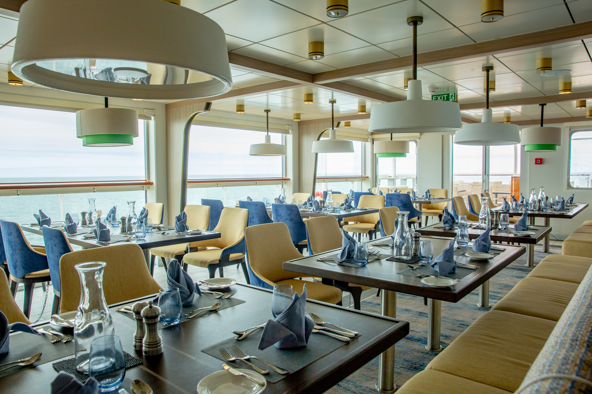 Cruise Ship Dining Room with Ocean View Cruise ship dining room with ocean view aboard Aurora Expeditions vessel