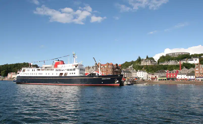 Cruise Ship Docked in Oban Harbor Hebridean Princess docked at Oban with colorful waterfront buildings and hillside architecture