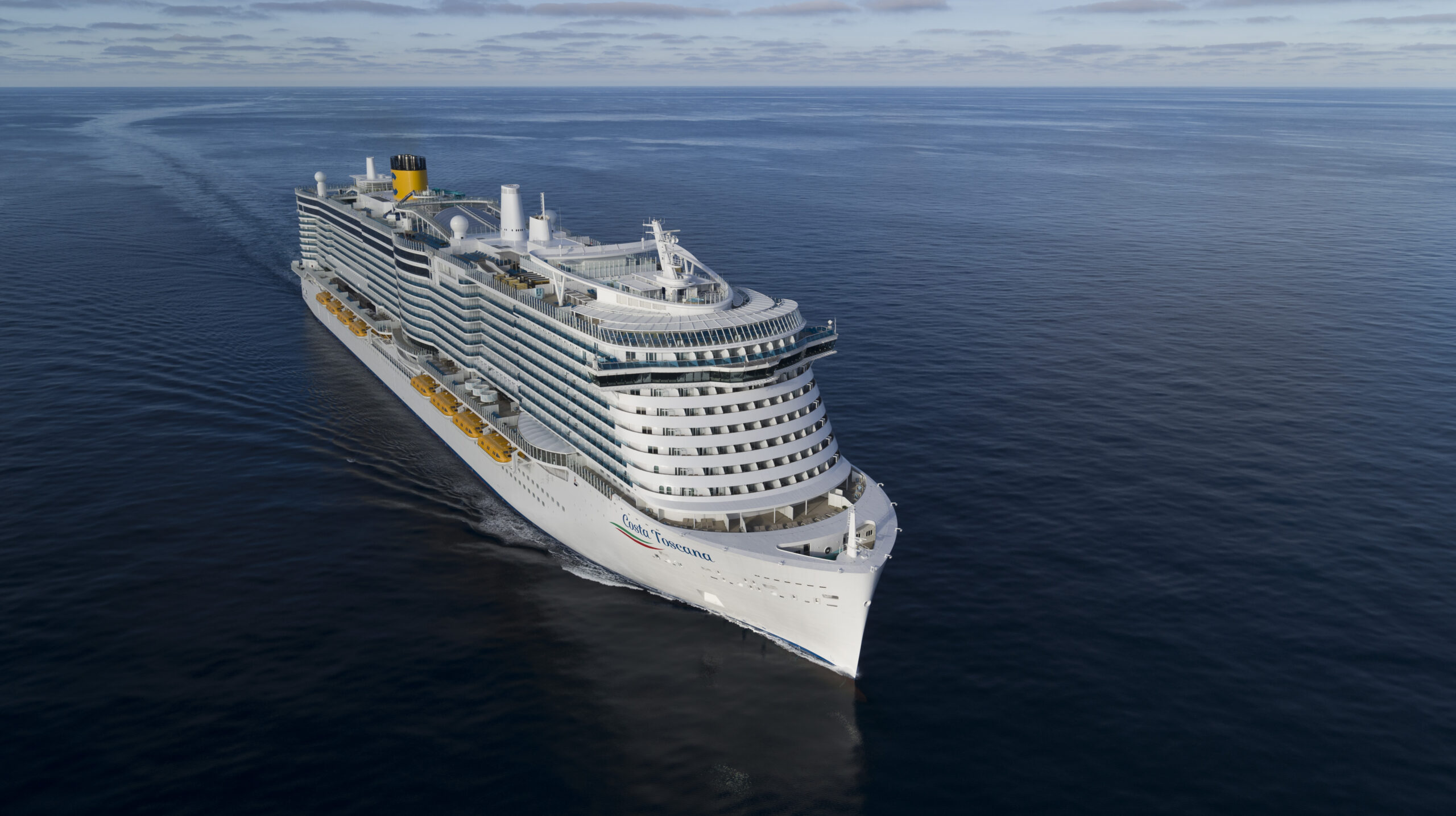 Cruise Ship Sailing on Calm Blue Ocean Costa Toscana cruise ship sailing through calm Mediterranean waters