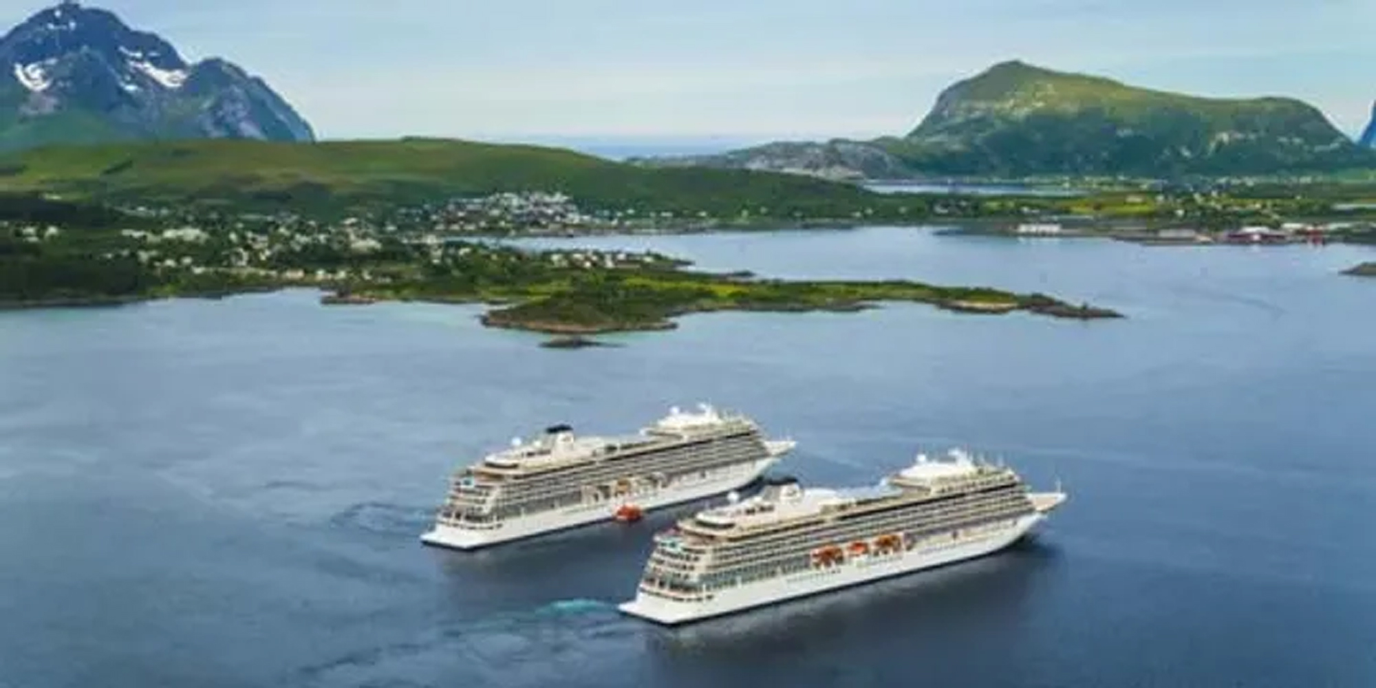 Cruise Ships in Norwegian Fjord Landscape Two cruise ships anchored in a picturesque Norwegian fjord surrounded by lush green mountains