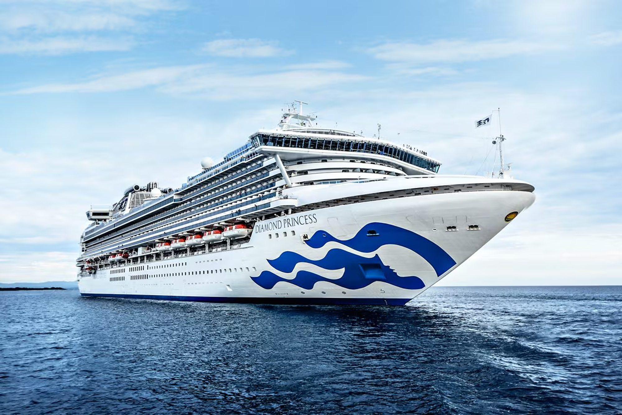 Diamond Princess Cruise Ship at Sea A white and blue Princess Cruises vessel sailing on open waters, featuring the distinctive blue