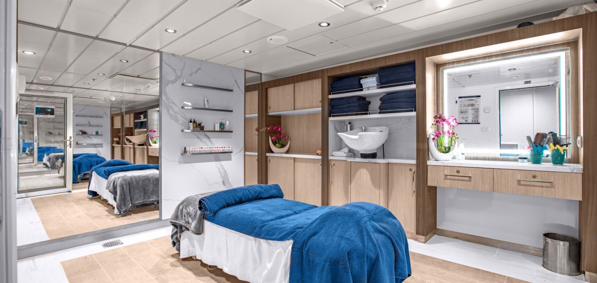 Modern expedition cruise ship cabin suite with spacious bathroom and premium amenities