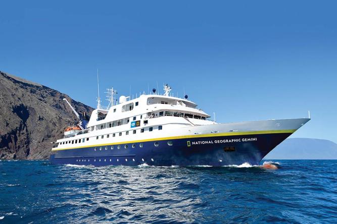 National Geographic Gemini Expedition Cruise Ship The National Geographic Gemini, a modern expedition cruise ship, anchors in crystalline blue waters