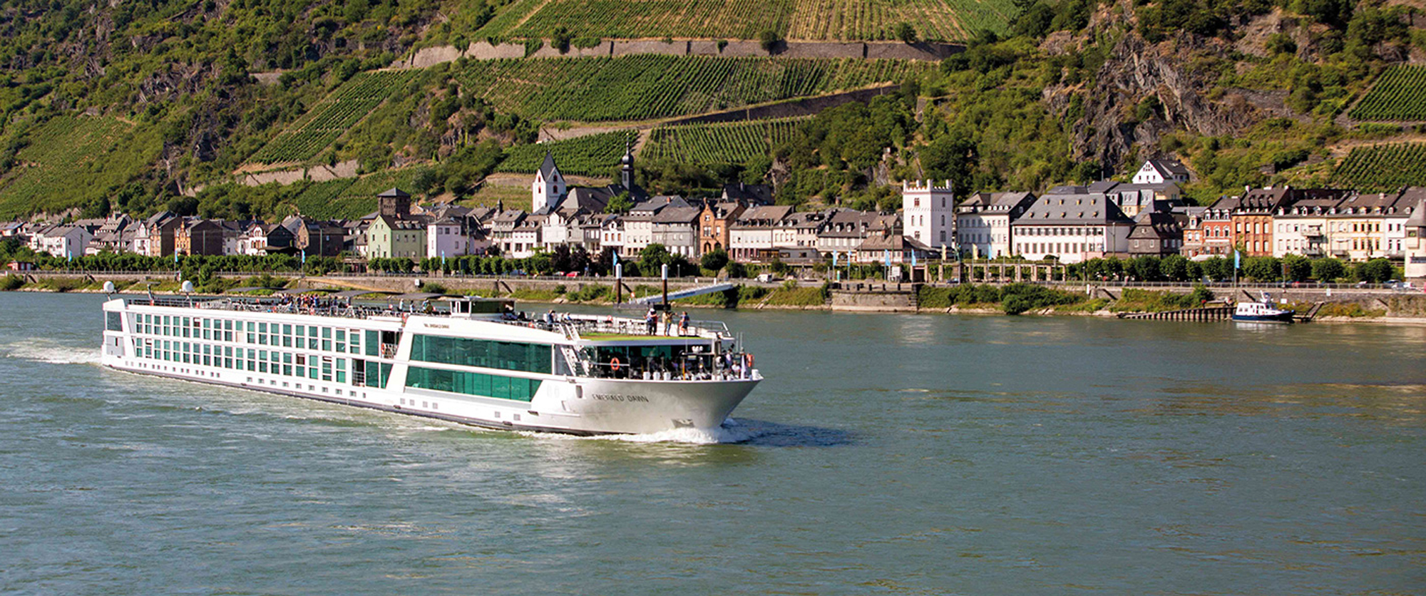 River Cruise Along the Rhine Valley River cruise along the Rhine Valley with lush hillsides