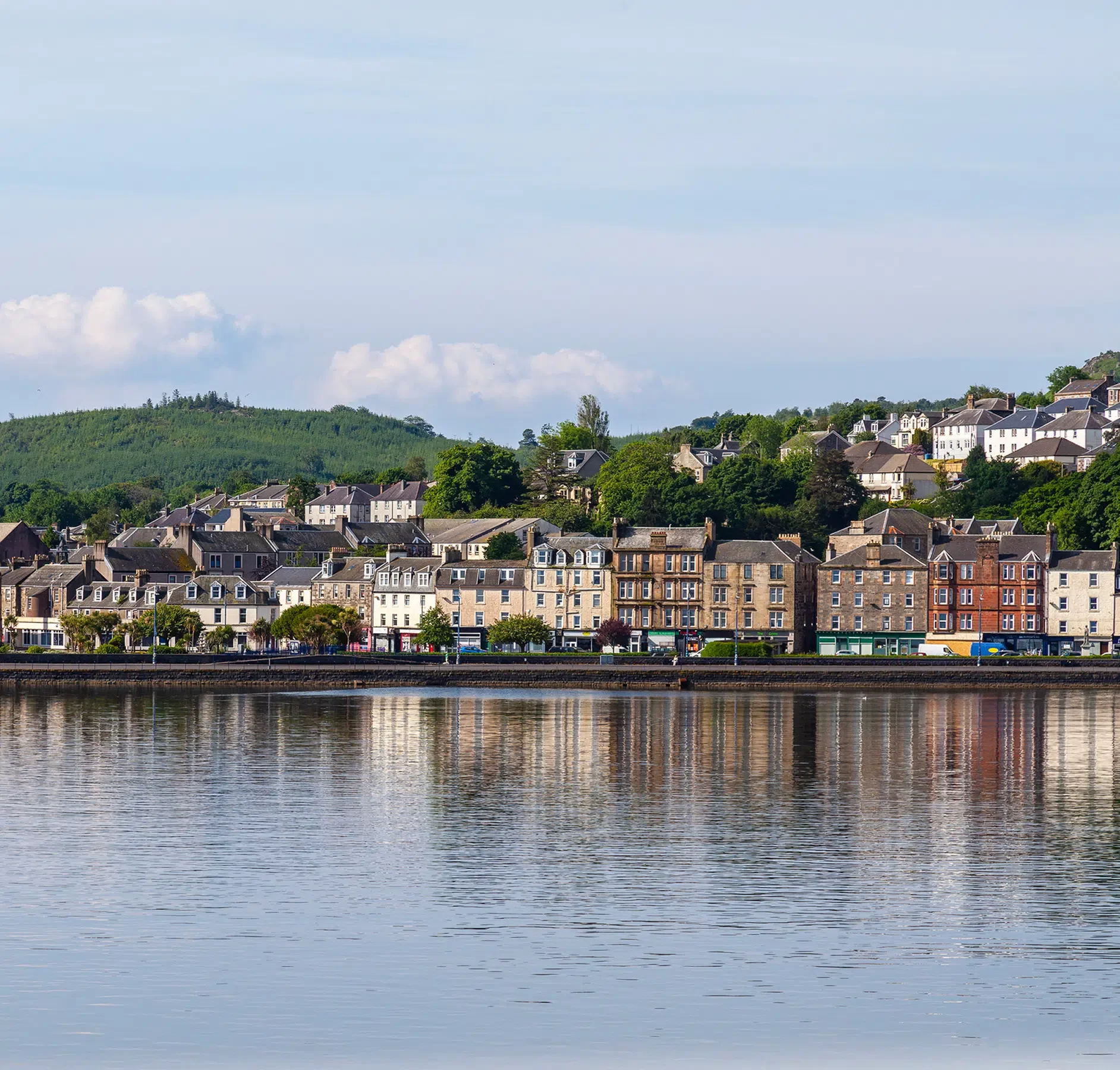 Scottish Riverside Town Waterfront View A picturesque Scottish riverside town with traditional Georgian and Victorian stone buildings reflected in calm waters