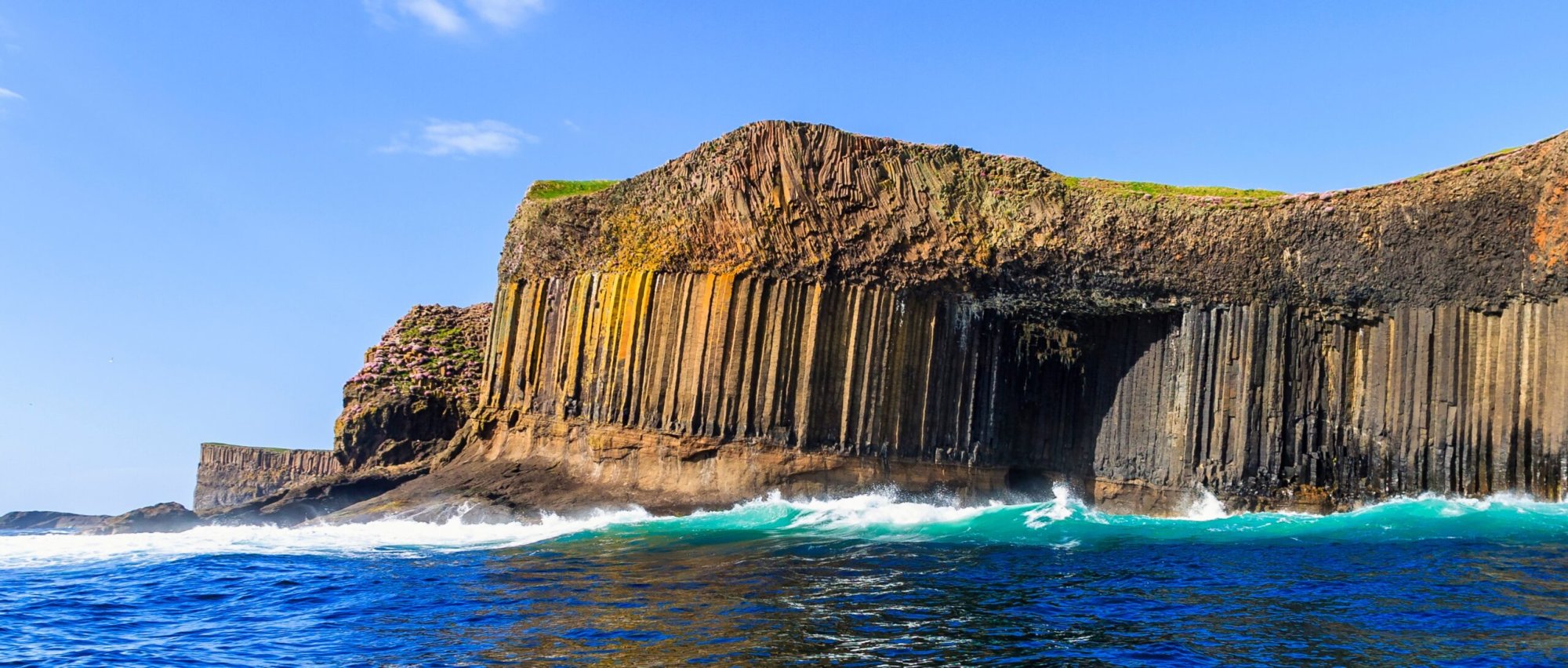 Staffa Basalt Columns and Coastal Cliffs Dramatic hexagonal basalt columns of Staffa rising from turquoise waters off the Scottish coast