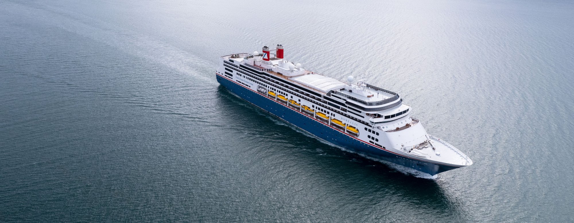 borealiscruising2440x950min Borealis cruise ship sailing through calm waters