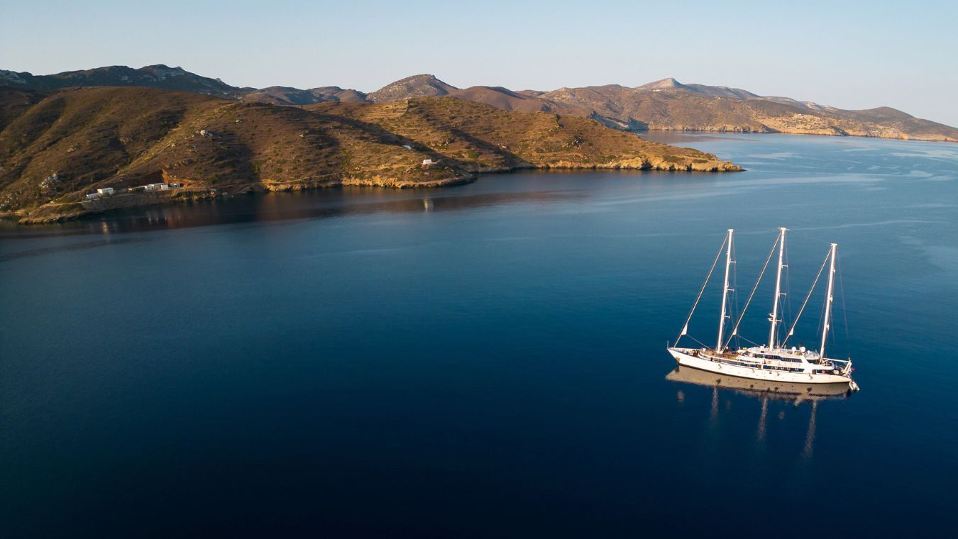 panorama-6-ddf6b47d11 Sailing vessel anchored in a Mediterranean cove