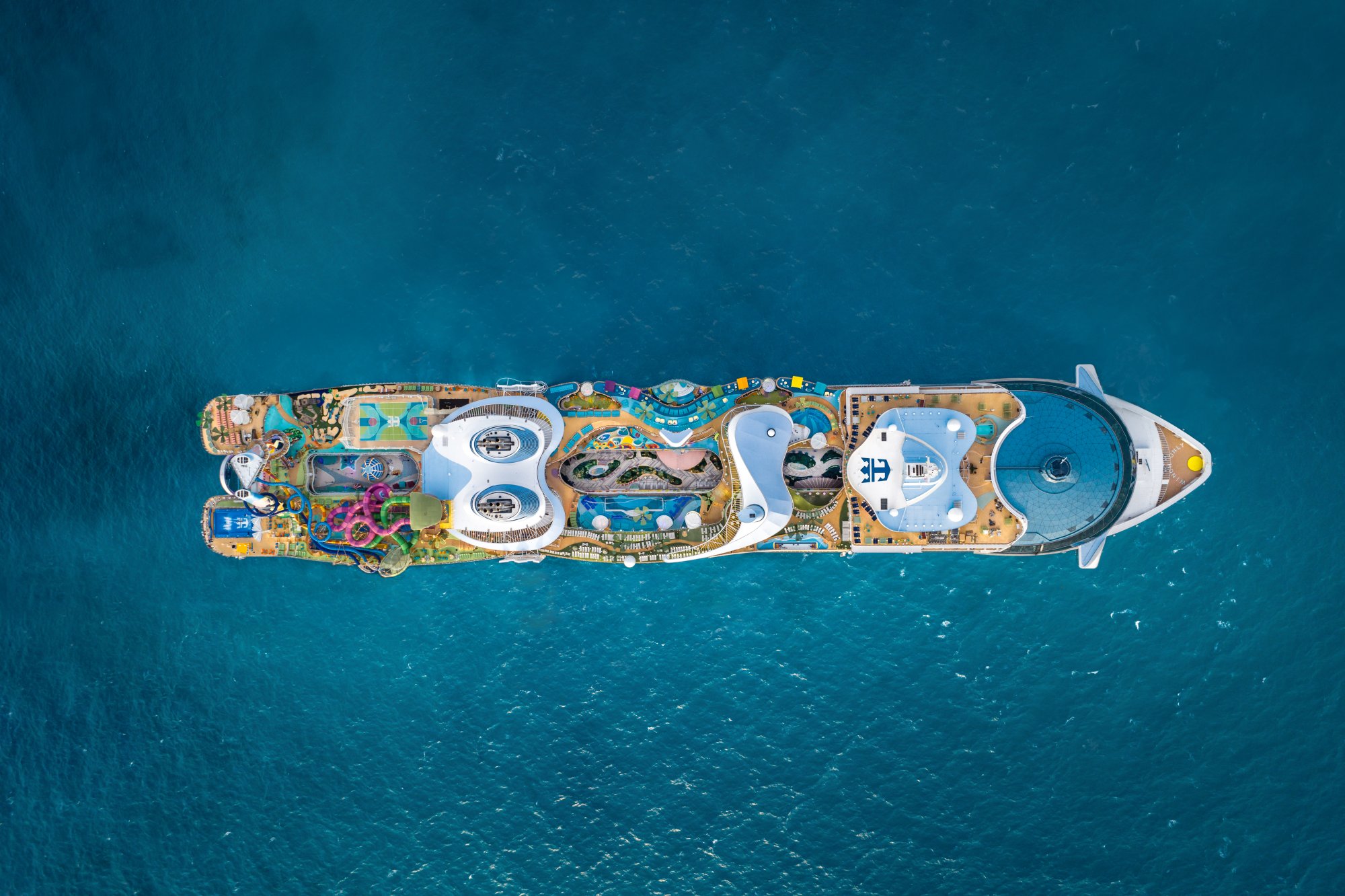 Aerial View of Cruise Ship in Caribbean Waters An overhead aerial view of a large modern cruise ship anchored in turquoise Caribbean waters