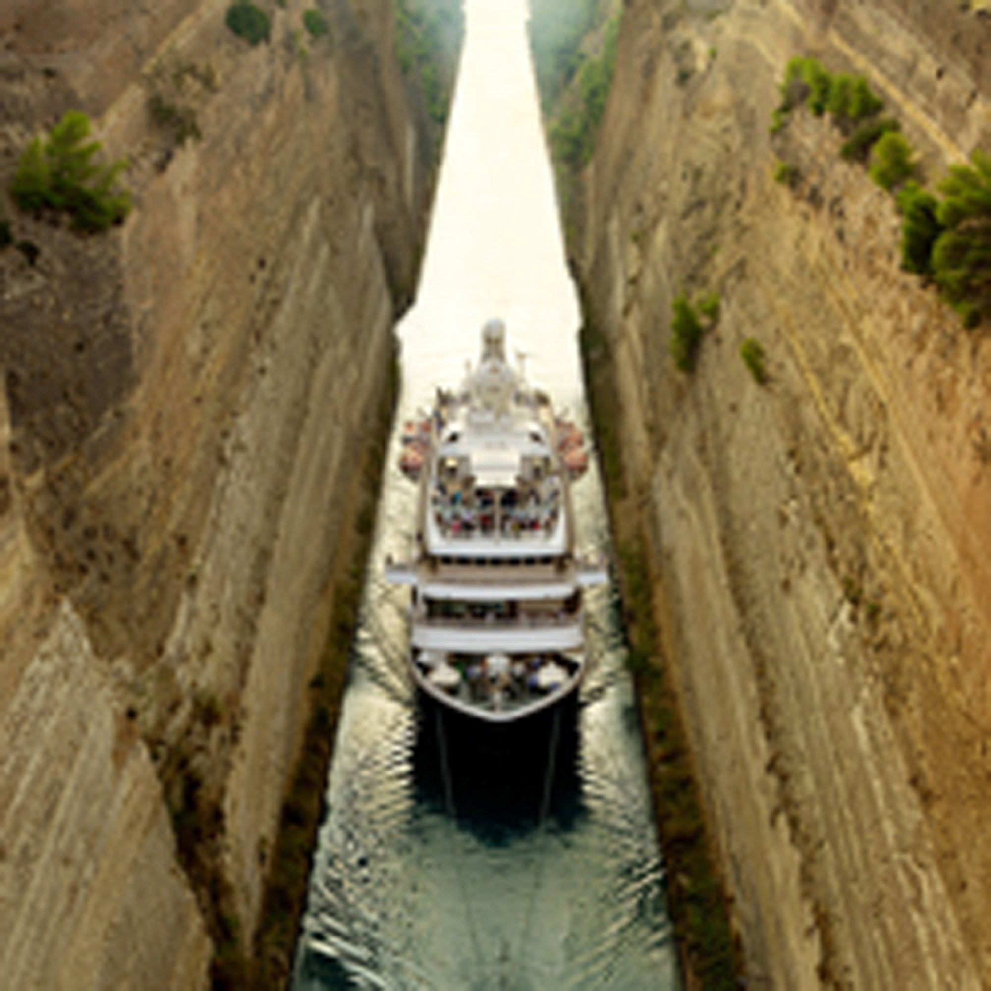 Cruise Ship Navigating Narrow Canal Cruise ship navigating a narrow canal with scenic coastline