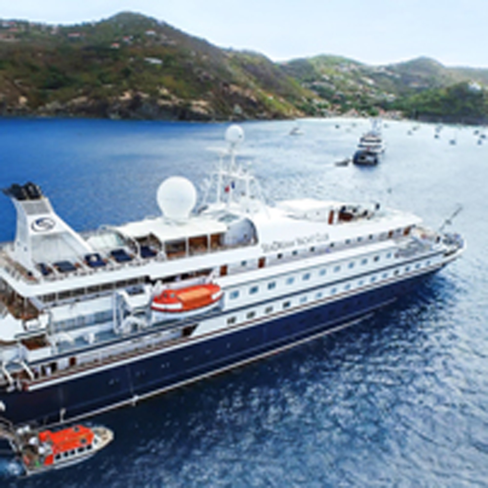 Luxury Cruise Ship Anchored in Adriatic Bay Luxury cruise ship anchored in a Mediterranean bay surrounded by lush green hills