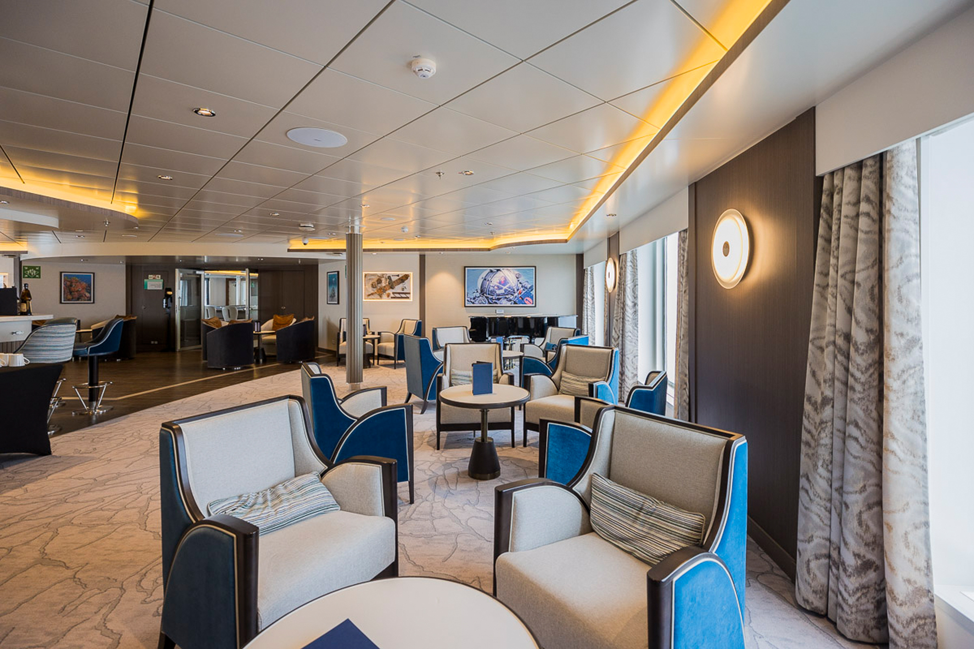 Modern Cruise Ship Lounge and Bar Area An elegant and contemporary lounge area aboard a cruise ship, featuring modern furnishings