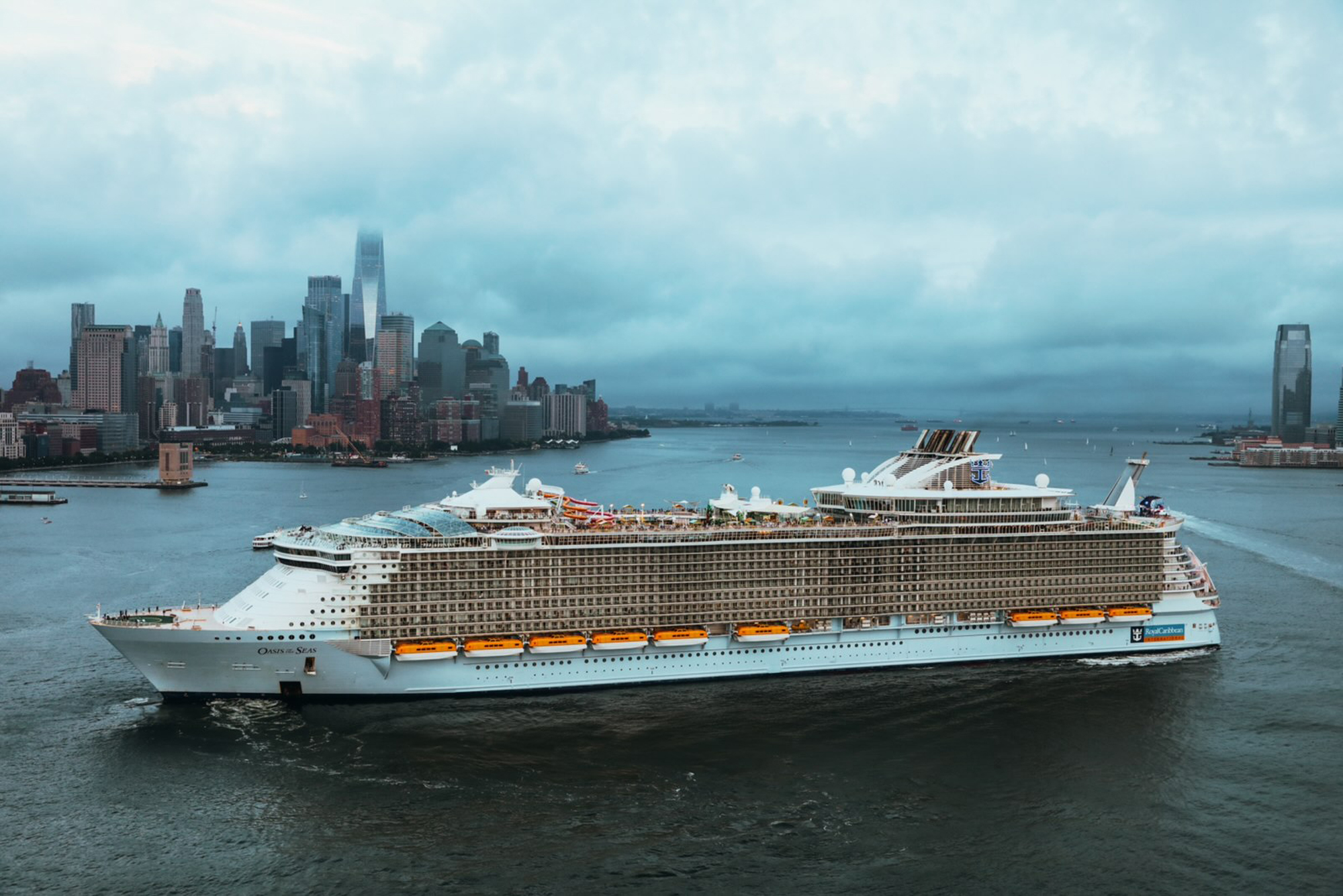 Oasis of the Seas in New York Harbor A massive modern cruise ship anchored in New York Harbor with the Manhattan skyline in