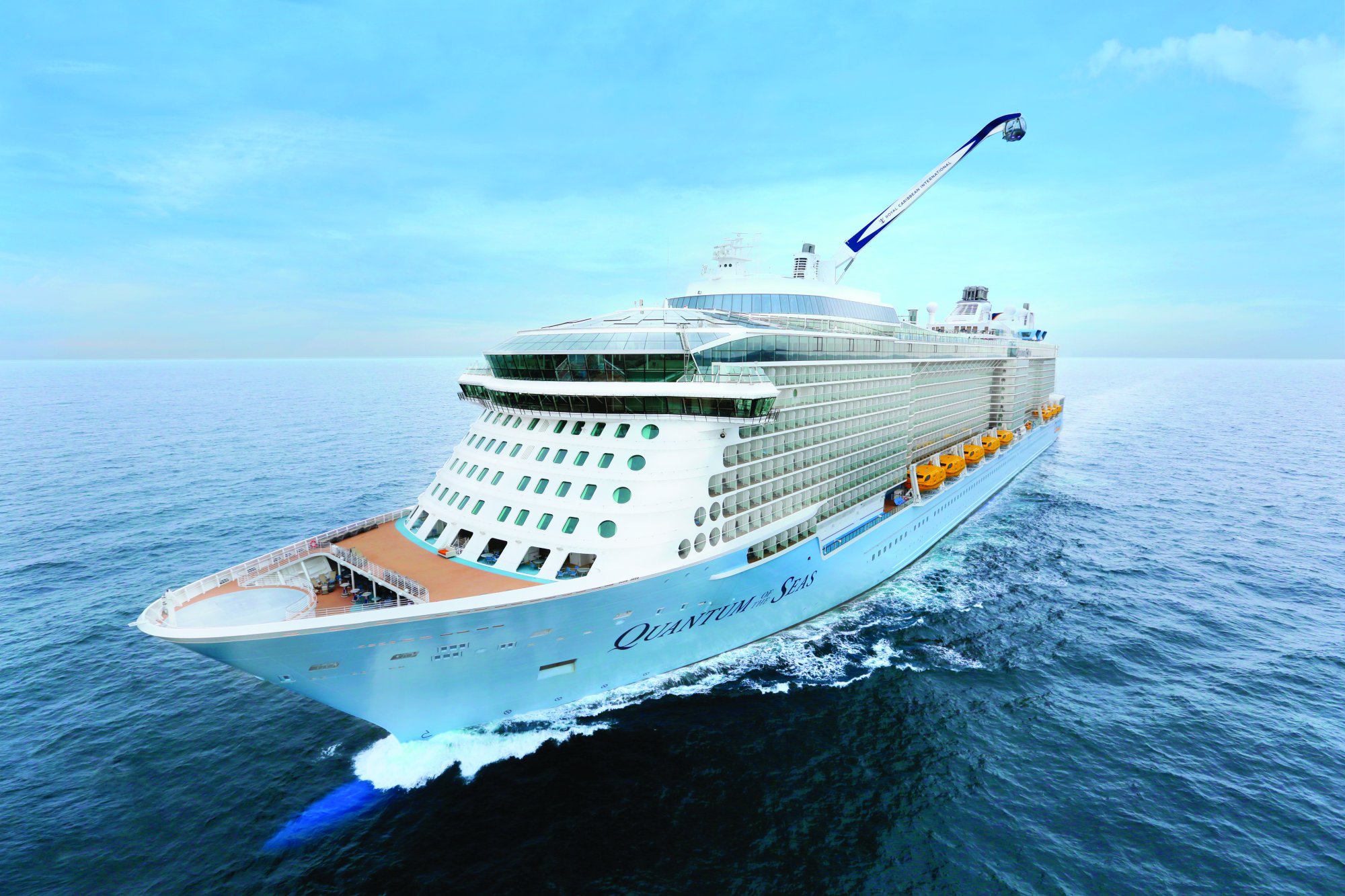 Quantum of the Seas Cruising at Sea A magnificent aerial view of the Quantum of the Seas cruise ship sailing through calm blue ocean