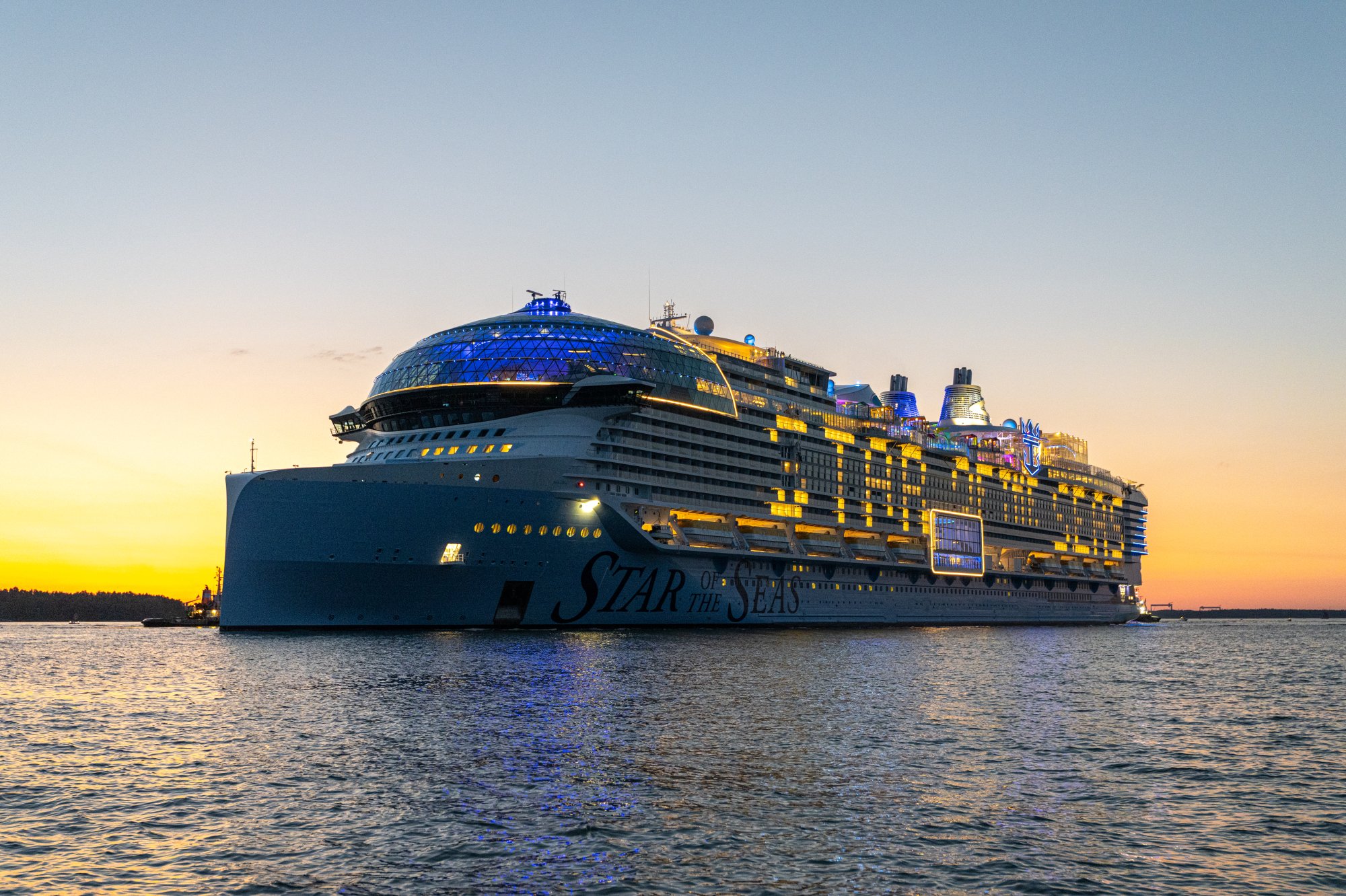 Star of the Seas Cruise Ship at Sunset A massive modern cruise ship illuminated by golden sunset light, moored in calm waters with its