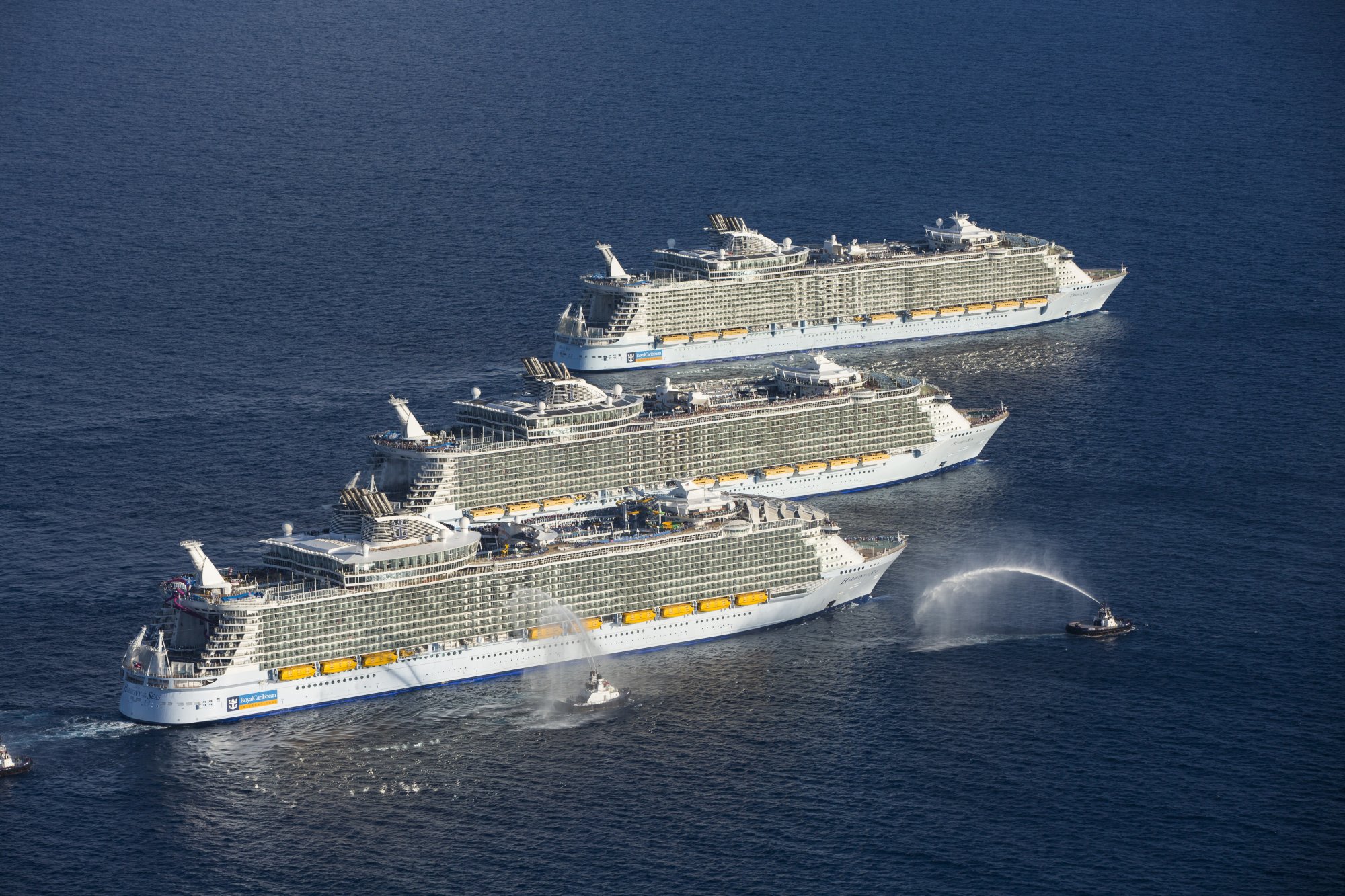 Three Royal Caribbean Sister Ships at Sea An aerial view of three large cruise ships lined up together offshore Port Everglades, Florida