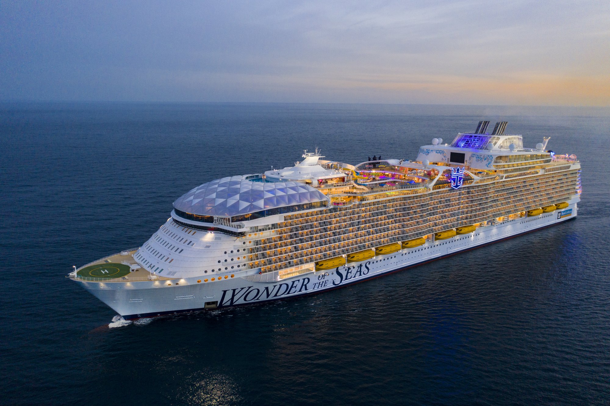 Wonder of the Seas Cruise Ship at Sea An aerial view of the Wonder of the Seas, a massive modern cruise ship, photographed during golden