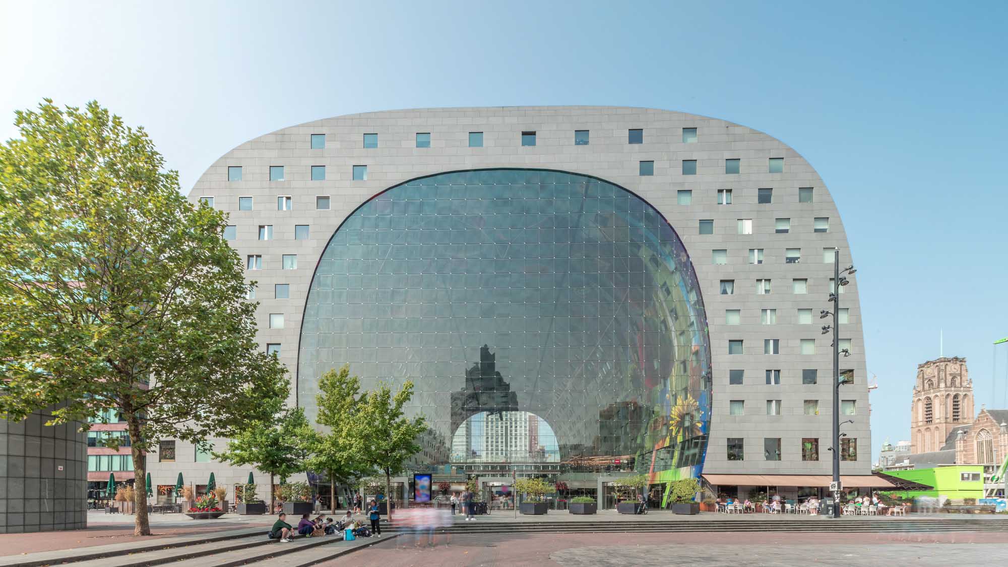 The iconic horseshoe-shaped Markthal building in Rotterdam, Netherlands, featuring a striking
