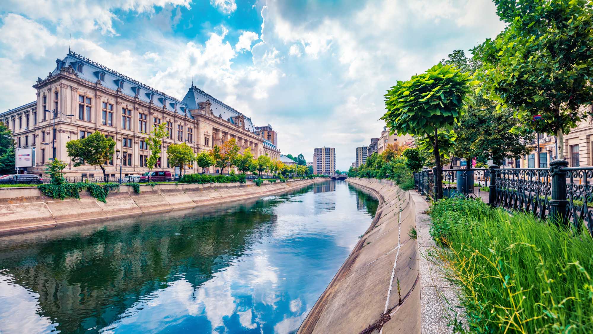 Court of Appeal Building on Dambovita River, Bucharest A scenic summer cityscape of Bucharest featuring the elegant Court of Appeal Building
