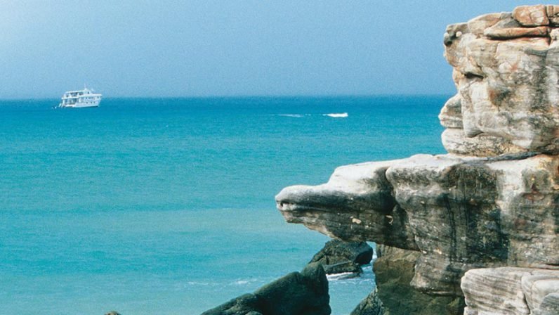 Kimberley Quest at Cape Londonderry A dramatic coastal landscape featuring distinctive weathered rock formations jutting into brilliant