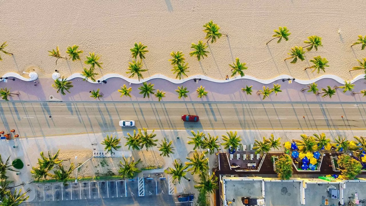 Aerial View of Fort Lauderdale Beach and A1A An aerial perspective of Fort Lauderdale's iconic beachfront along A1A, featuring palm trees