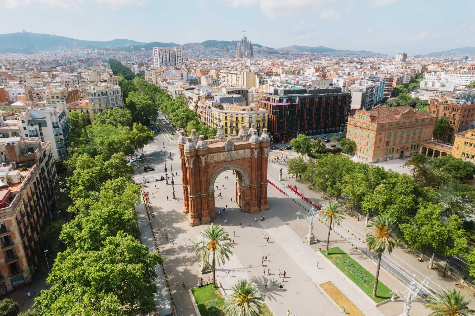 Aerial view of Barcelona's iconic Arc de Triomf (Arco de Triunfo), a monumental red-brick triumphal