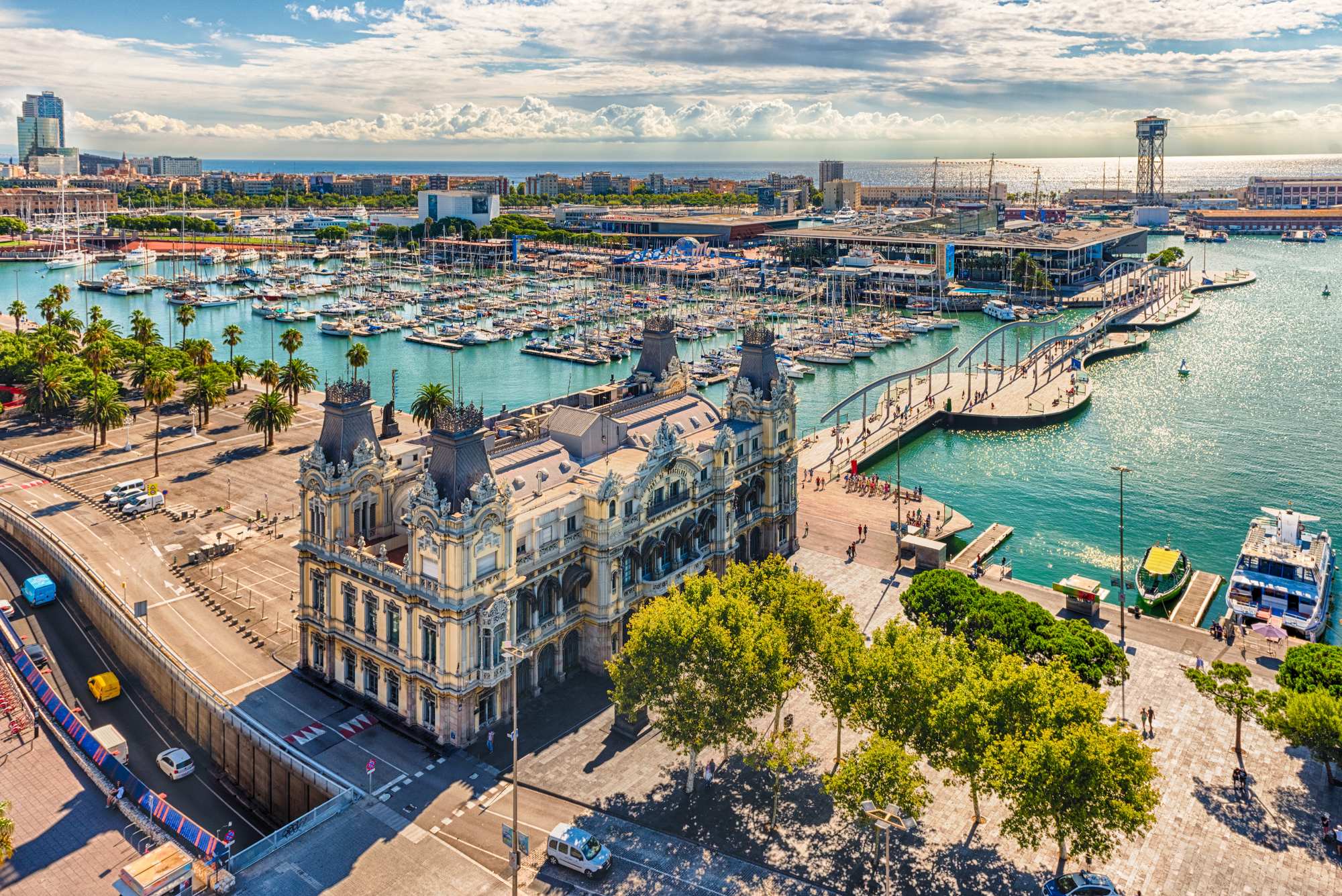 Barcelona Port Vell Maritime Hub An expansive aerial view of Barcelona's Port Vell waterfront district, featuring the iconic