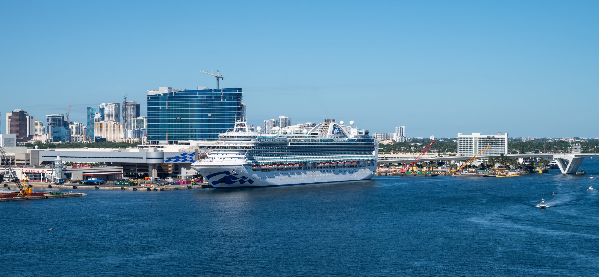 Modern Cruise Ship Docked at Port Everglades A large contemporary cruise ship with distinctive blue hull design is docked at Port Everglades