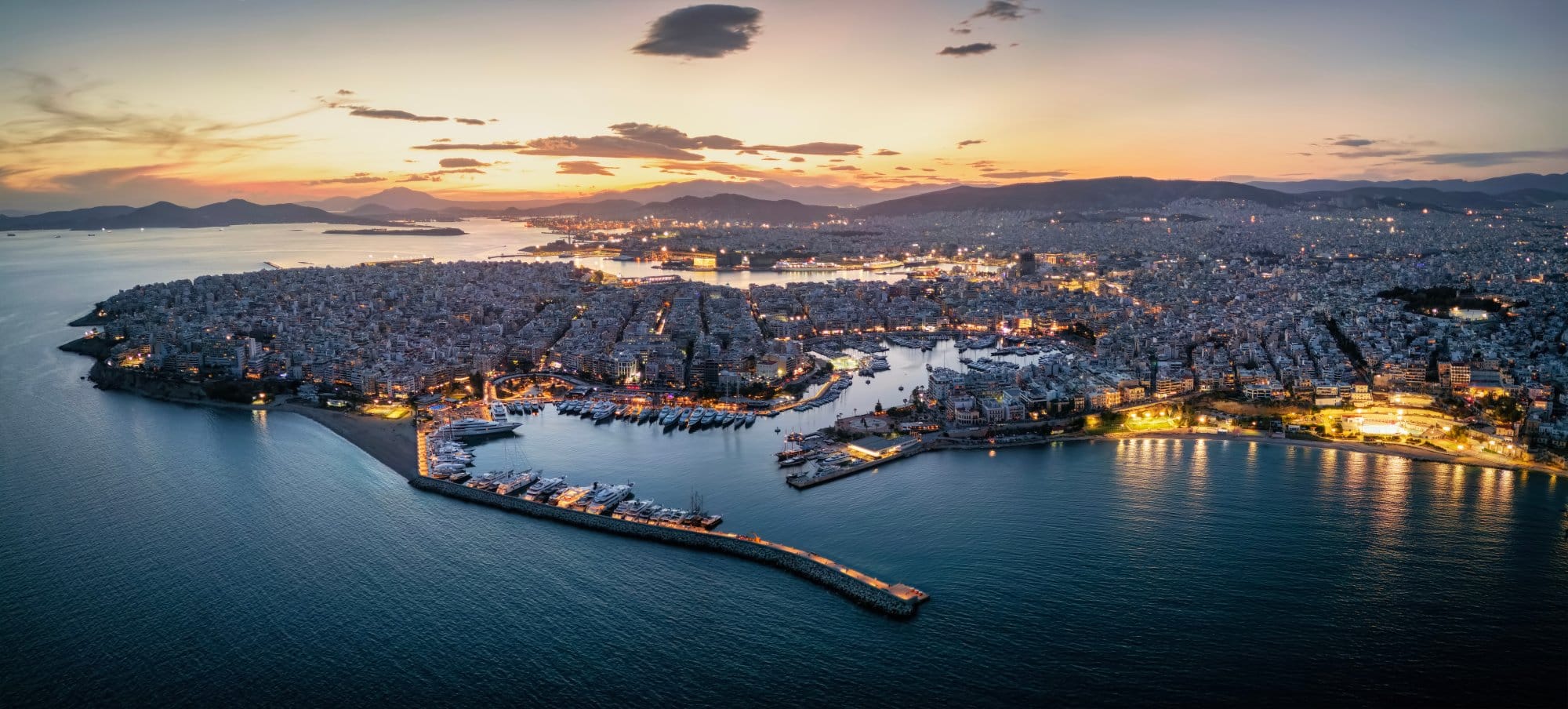 Piraeus Port at Twilight, Athens Greece An aerial twilight view of Piraeus, Greece's largest port city near Athens, showcasing densely