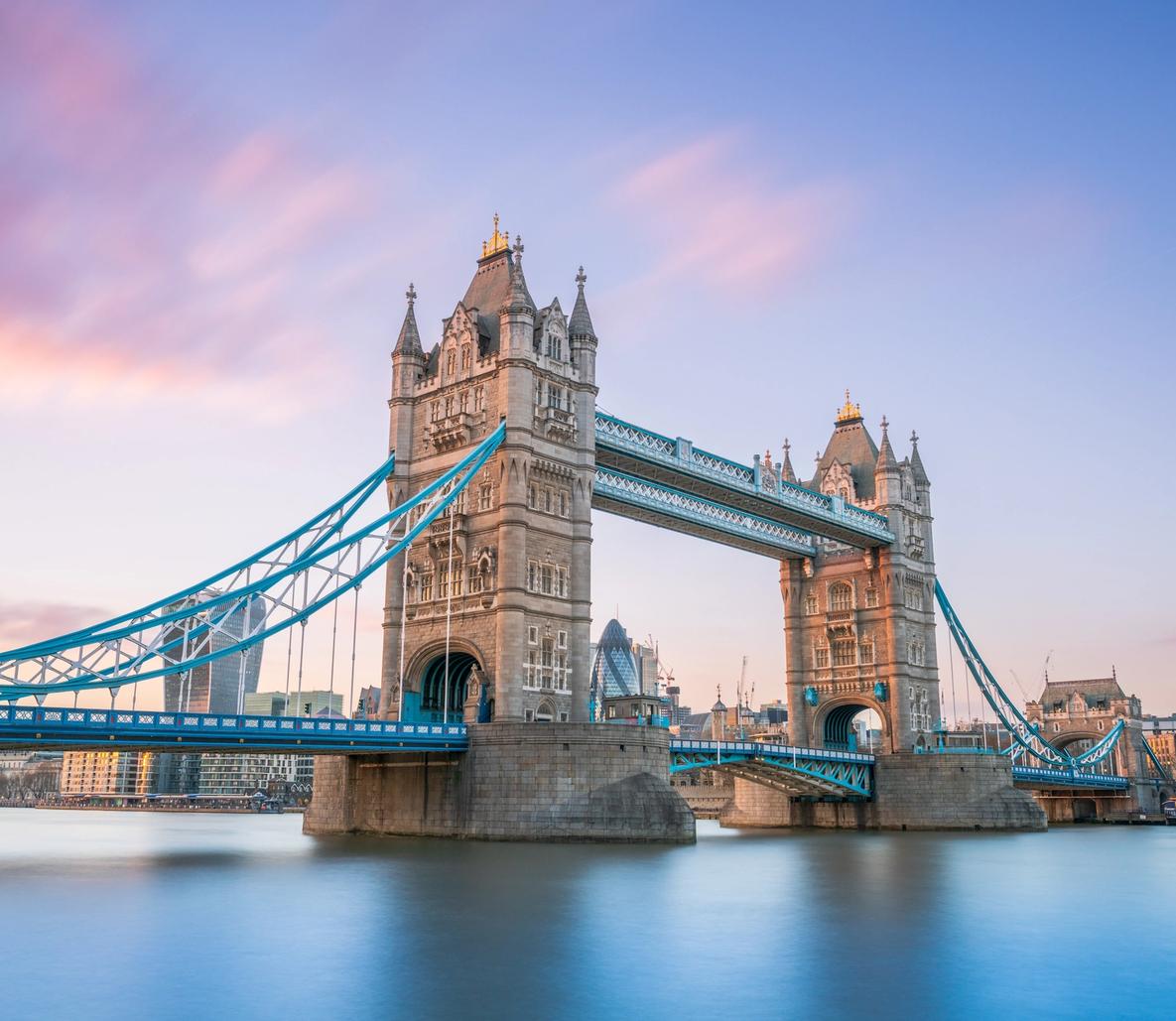 Tower Bridge London at Sunrise An iconic view of Tower Bridge spanning the River Thames in London, England, captured during golden